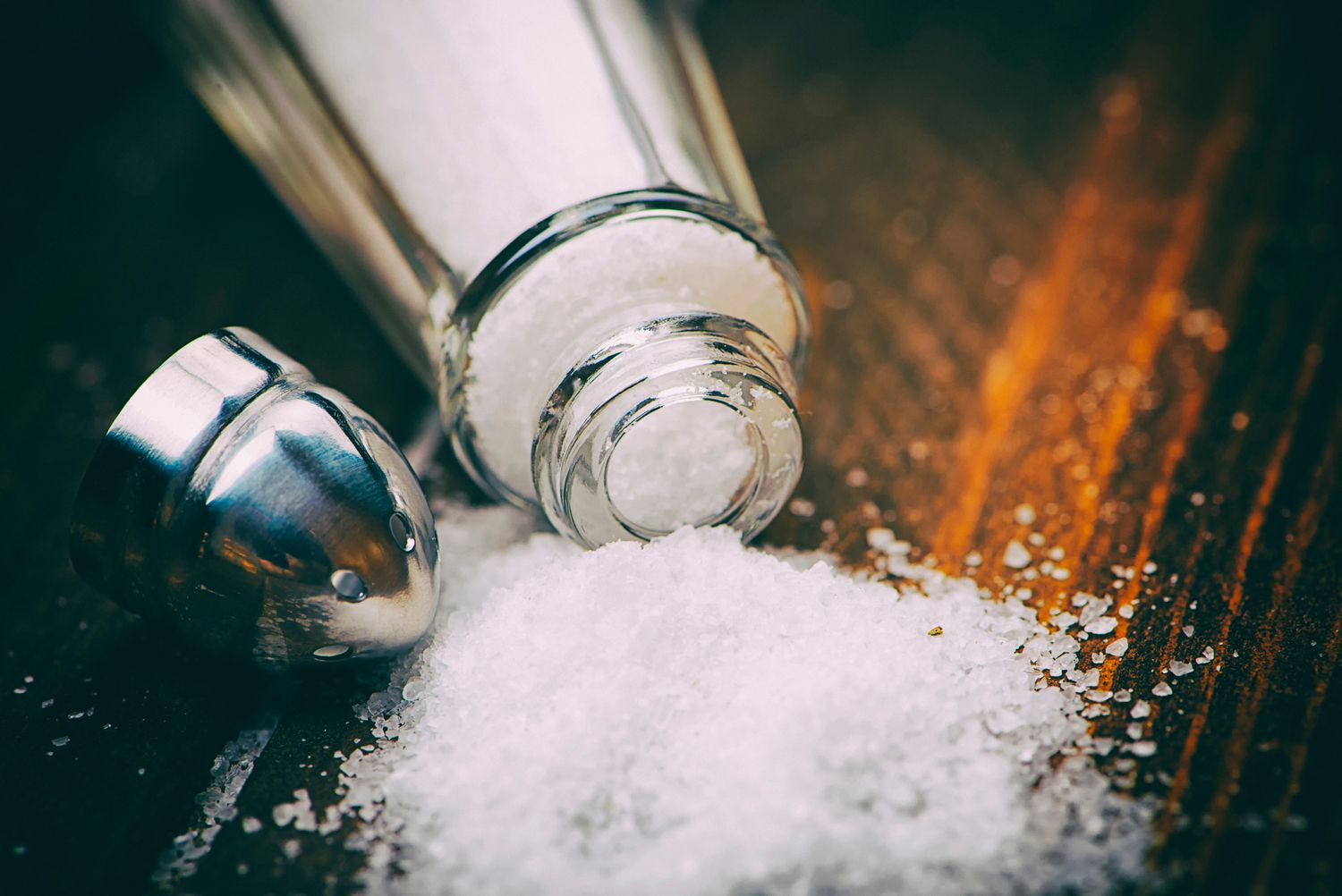 What are the risks of using table salt for piercings